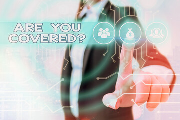 Writing note showing Are You Covered Question. Business concept for asking if they had insurance in...