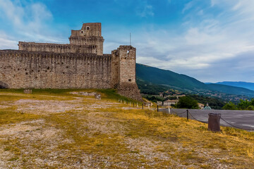 A view across the summit of Mount Subasio towards the Castle Rocca Maggiore above the town of Assisi, Umbria in the summertime