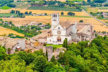 A view from the summit of Mount Subasio towards the Basilica of St Francis in Assisi, Umbria in the summertime