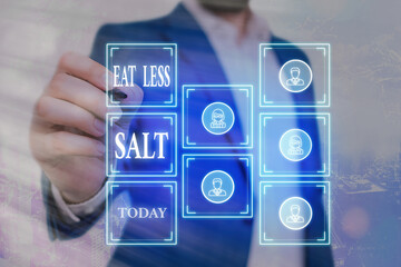 Writing note showing Eat Less Salt. Business concept for reducing the sodium intake on the food and...