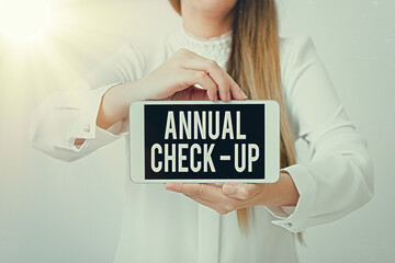 Text sign showing Annual Checkup. Business photo showcasing yearly reproductive health visit with a health care provider Model displaying black screen modern smartphone mock-up for personal interest