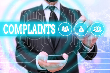 Text sign showing Complaints. Business photo showcasing something that is the cause or subject of...