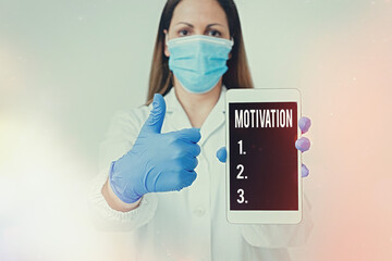 Conceptual hand writing showing Motivation. Concept meaning the general desire or willingness of someone to do something Laboratory technician featuring paper accessories smartphone - obrazy, fototapety, plakaty