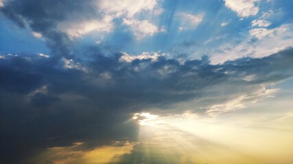 sunset evening sparking light from the Sun with cloudy sky over the river