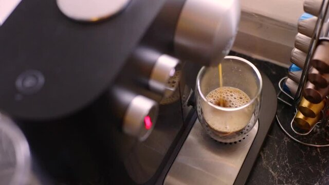 Delicious coffee being made in kitchen