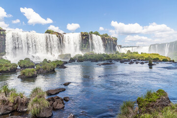 Forest, waterfalls and river with rocks
