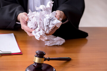 Old male judge working in courthouse