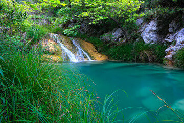 Natural waterfall and lake in Polilimnio area in Greece