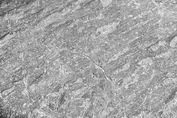 Stone texture. Stone old wall. Granite natural surface. Texture pattern. Natural stone close-up. Structural surface close-up.
