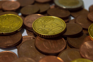 Assorted euro coins with 50 cents on the center close up