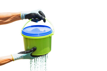 A worker holds a bucket for food