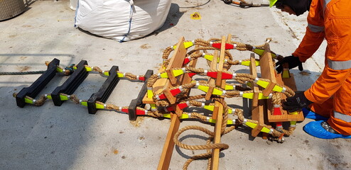 picture of a marine ladder used to usually embark on board boats while they are at sea,also called...