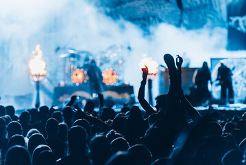 Metal fan enjoying concert of his favorite band and crowd-surfing