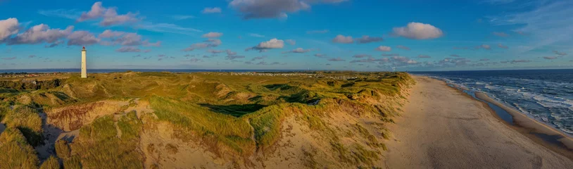 Fotobehang Panoramic aerial view of  Lyngvig lighthouse on wide dune of Holmsland Klit  with beach view on the west coast of Jutland, by Hvide Sande, Denmark © snapshotfreddy