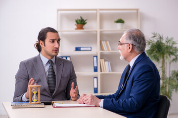 Two businessmen in time management concept