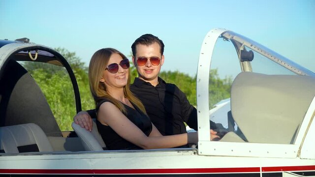 Business partners before flying in a small plane. Small aviation concept