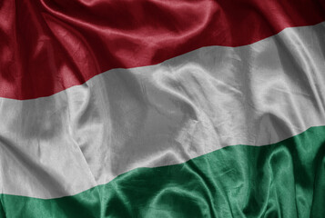 colorful shining big national flag of hungary on a silky texture.