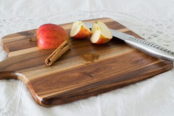 Apple and cinnamon on cutting board