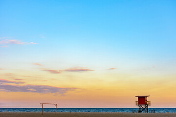 Fototapeta premium Rescue cabin on Copacabana beach at a tropical sunset on Rio de Janeiro city, Brazil