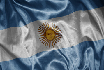 colorful shining big national flag of argentina on a silky texture.