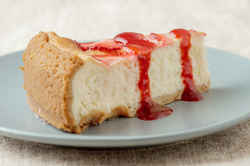 delicious cheesecake with strawberries and jam, food photo.