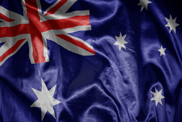 colorful shining big national flag of australia on a silky texture. © luzitanija