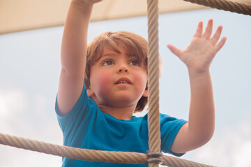 Little boy playing at the park baker park in Naples florida 