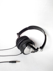 black headphones with silver on white background