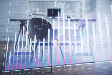 Double exposure of financial graph drawing and office interior background. Concept of stock market.