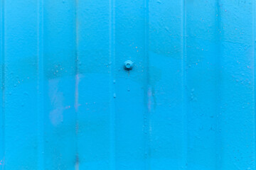 Metallic siding as a blue background. Close up.