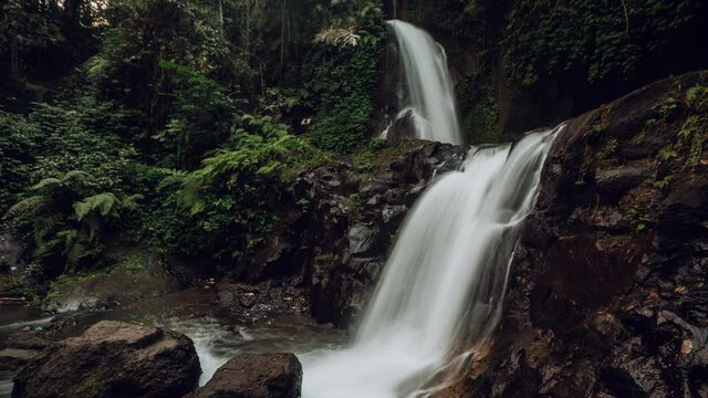 Waterfall Tibumana, Rain forest, jungle adventure, green park. Indonesia. Timelapse hyperlapse. High quality 4k footage video