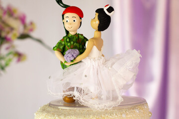 wedding cake and bride and groom