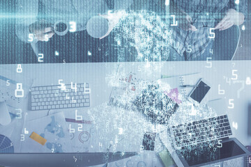 Obraz premium Double exposure of man and woman working together and data theme hologram drawing. Computer background. Top View.