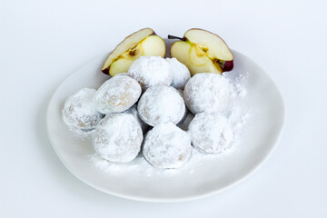 Apple cookies with powdered sugar in plate on the white surface.Close up taken