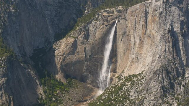 Close up view of waterfall, mountains, and valley in Yosemite National Park.