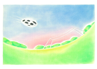 ゴールに向かって、勢いよく飛ぶサーッカーボール、背景には雄大な青空と夕焼けが見える