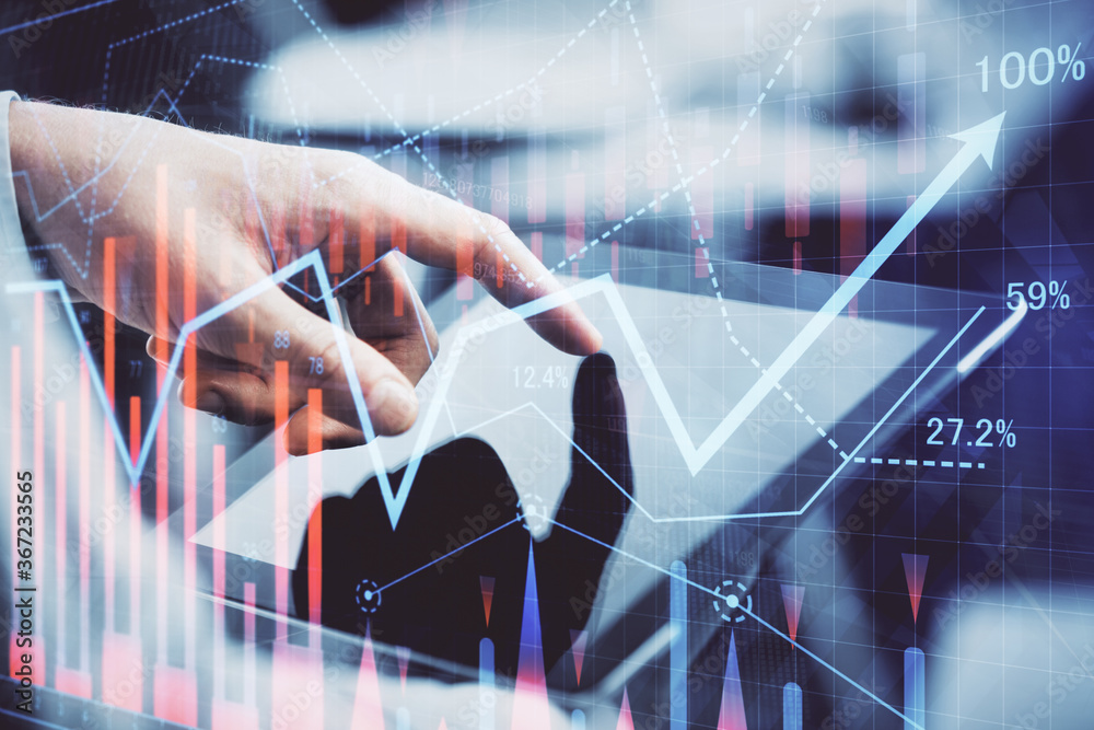 Poster multi exposure of man's hands holding and using a phone and financial chart drawing. market analysis