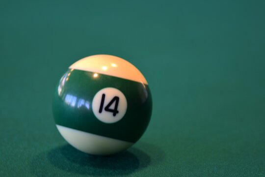 pool ball on a green table - Powered by Adobe