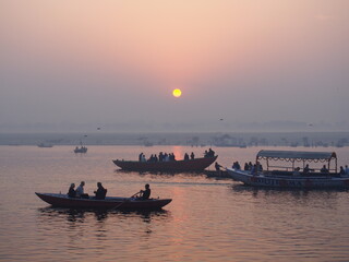 Naklejka premium Sunrise over the Ganges River and boats, Varanasi, Uttarpradesh, North India, India