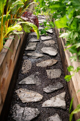 Stone Path through Raised Garden Beds