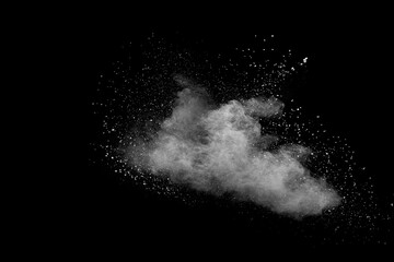 White talcume powder explosion on black background. White dust particles splash.