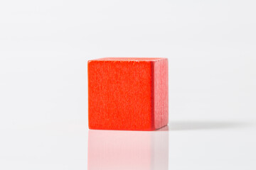 red wooden geometric shapes cube isolated on a white background