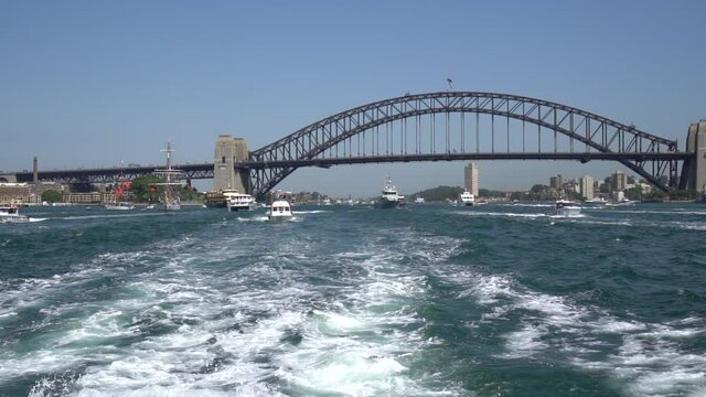 View from back of ferry on Sydney Harbour of Sydney harbour Bridge on Australia Day