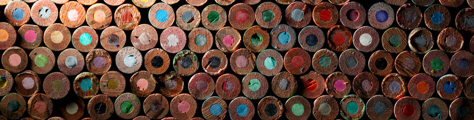Back of stack of used, old, and dirty colored pencils. - Powered by Adobe