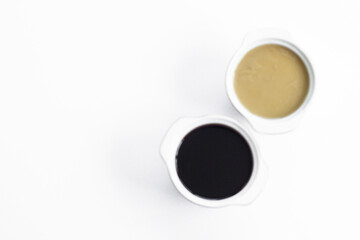 Traditional Turkish Halvah,and molasses on the wwhite background with large copy space.