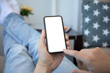 male hands holding phone with isolated screen in room house