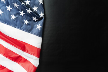 American flag on black background, stars and stripes closeup