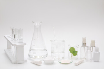 natural beauty organic botany with herb leaves scientific equipment researched, cosmetic bottle...
