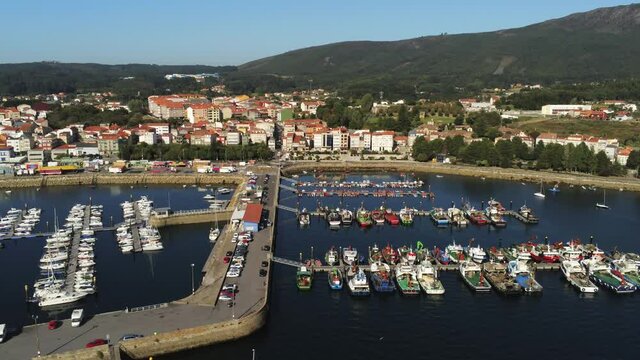 Boats in the marina. Coastal village of Galicia,Spain. Aerial Drone Video