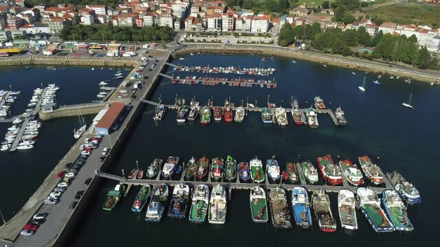 Boats in the marina. Coastal village of Galicia,Spain. Aerial Drone Video